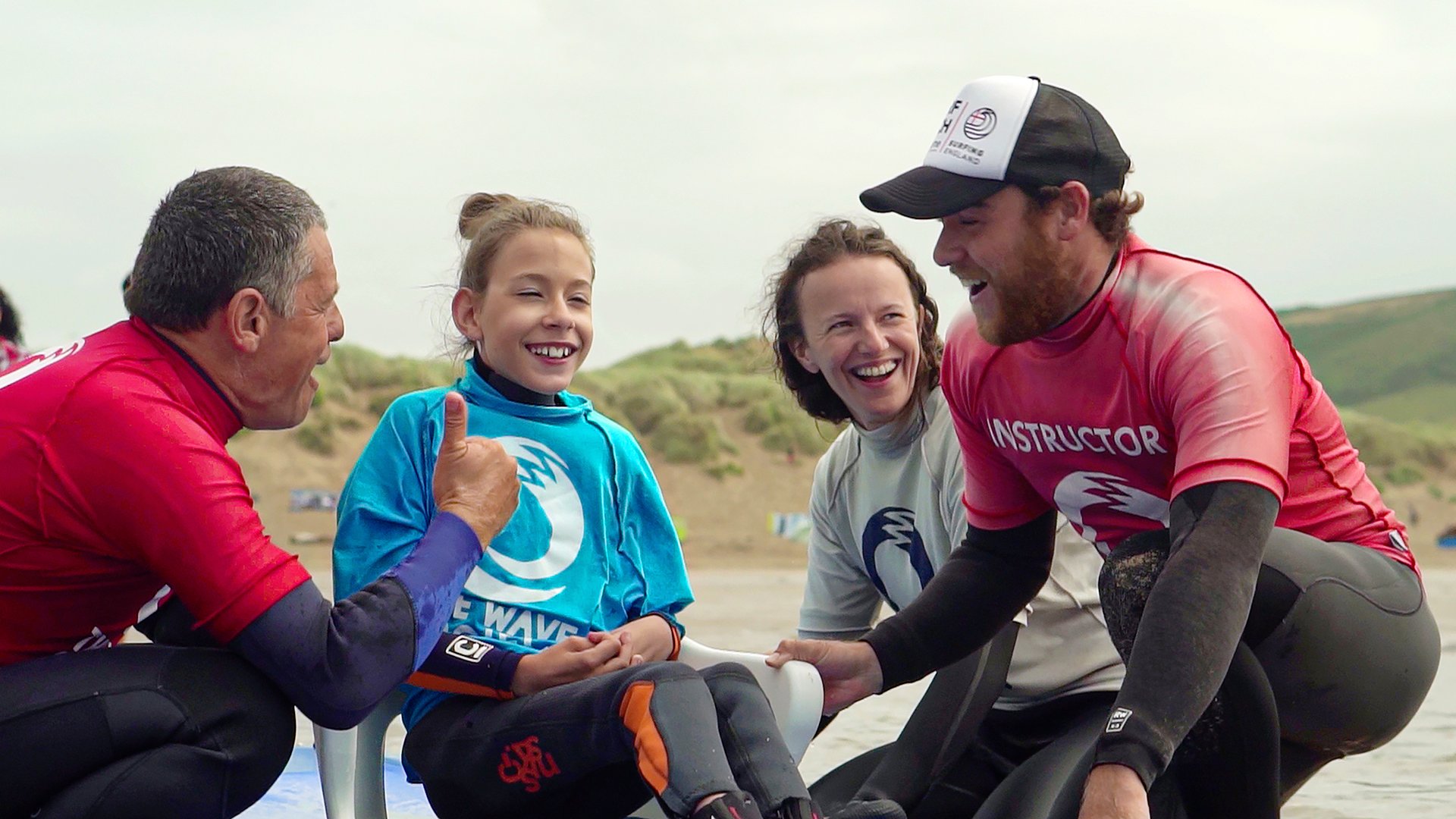 Becca surfing with her crew