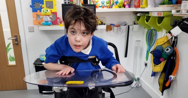 Young boy standing in the Innowalk Pro in a clinic