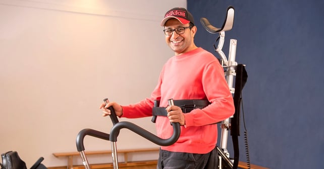 Man standing and smiling in the Innowalk Pro
