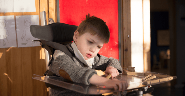 Young boy sits in his Innowalk