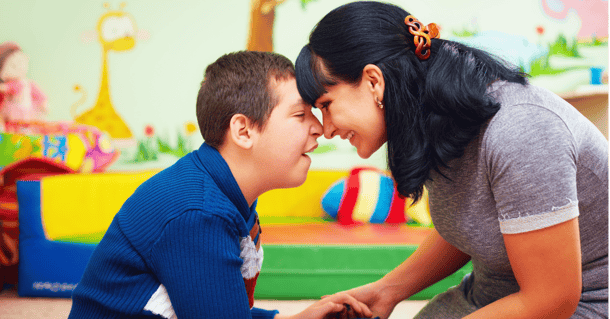 Child woth cerebral palsy interacting with grown woman. What types of outcome measures in cerebral palsy do we have?