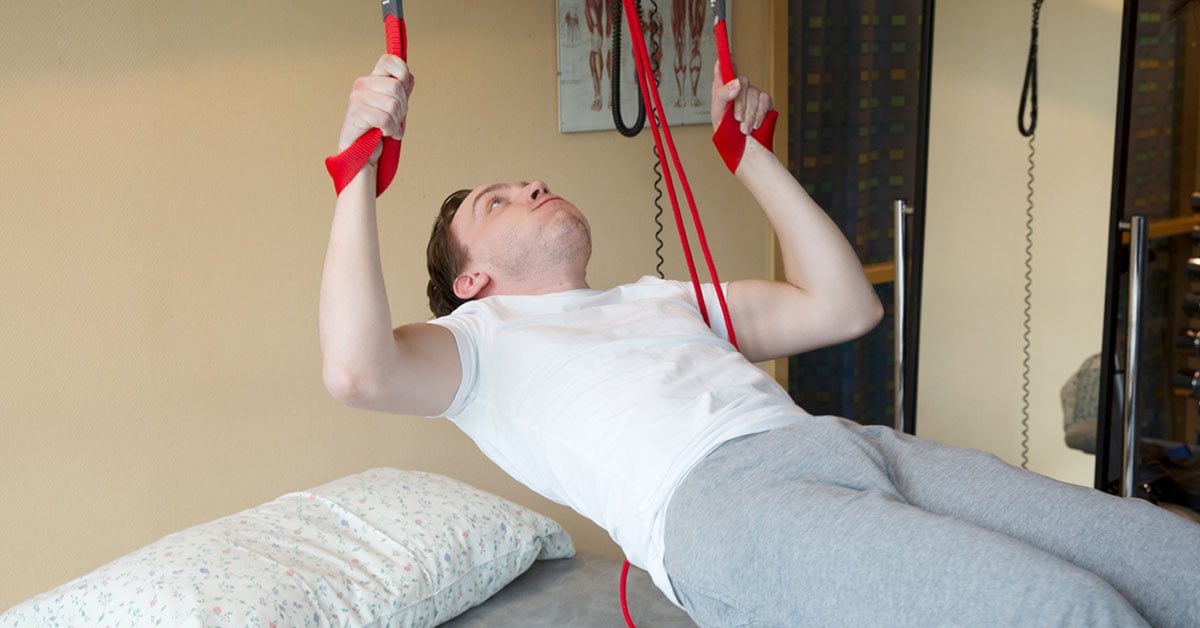 Young boy with cp doing sling training